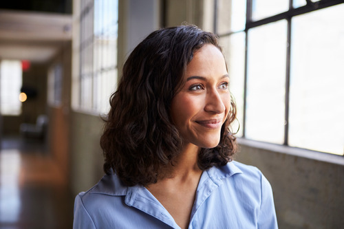 A businesswoman thinking about temporary work