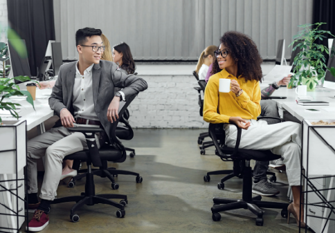 people smiling at each other in the office